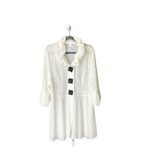 Stunning white textured topper with black accent buttons… Semi sheer…Puff sleeve